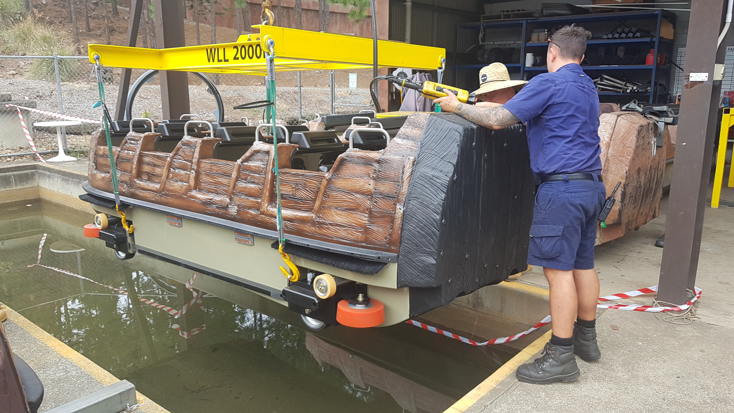Water ride boat being serviced by crew